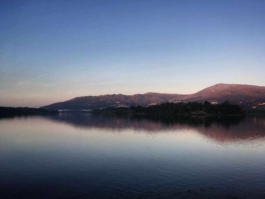 Panoramic view of a lake with mountains in the background