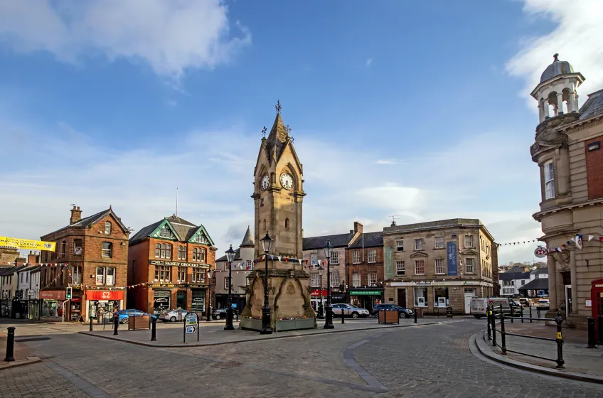 Penrith town centre with the Musgrave Monument clock tower on a sunny day